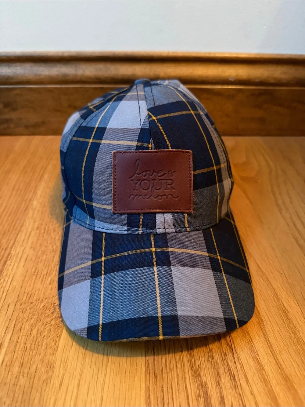 Love your melon plaid hat with leather logo